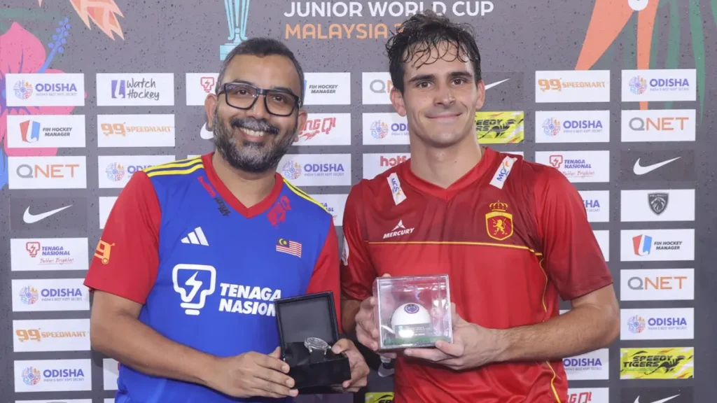 Chief Pathman presents Paul Petchame of Spain a Bernhard H. Mayer watch to commemorate him being named the Man of the Match at the semi-final