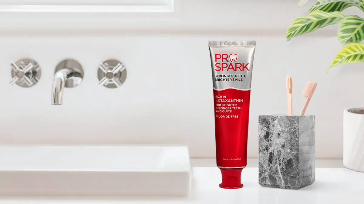 ProSpark toothpaste and wooden toothbrushes, tools for oral health, in a holder beside a bathroom sink